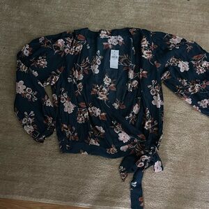 New w tags. Deep floral v neck. Long sleeves
